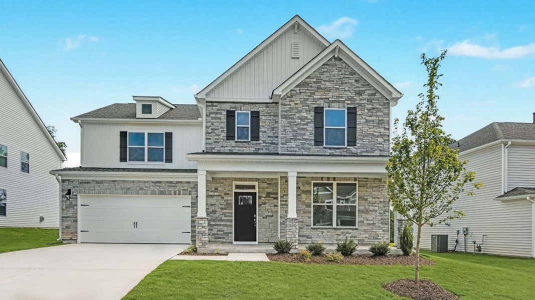 Representative exterior photo of a completed home built from the Jordan by D.R. Horton in The Manors at Galvins Ridge, Sanford, NC (Image 25).