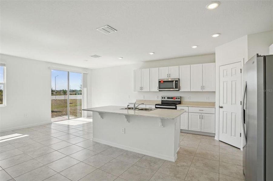 Furnished interior view inside a new home in Lake Deer Estates - Signature Series, Poinciana (Image 16). Furnished interior view inside a new home in Lake Deer Estates - Signature Series, Poinciana (Image 16).