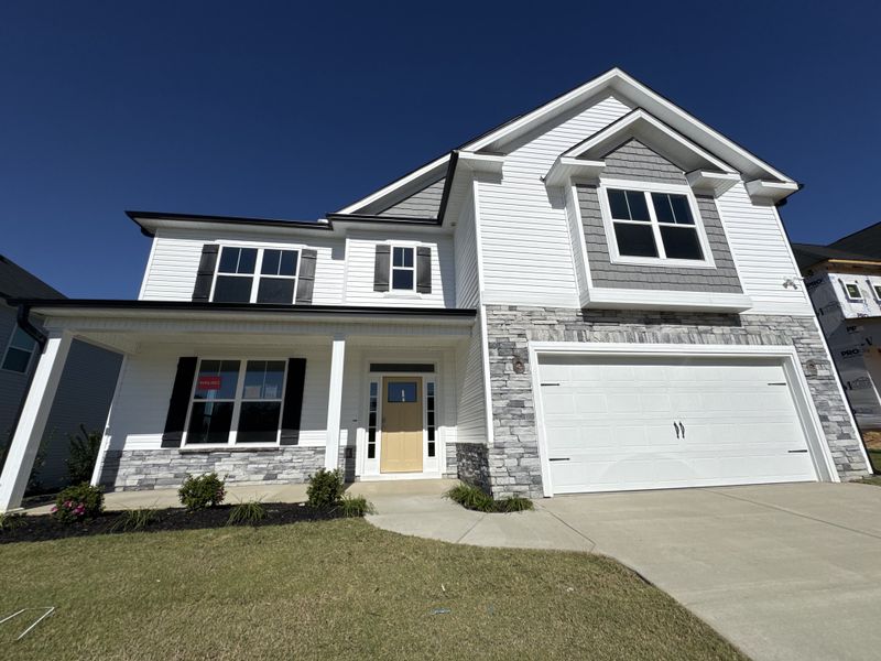 Front exterior of a new home in Windsor, North Augusta, SC, highlighting curb appeal (Image 2). Front exterior of a new home in Windsor, North Augusta, SC, highlighting curb appeal (Image 2).