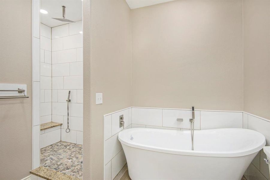 Bathroom with a freestanding bath and walk in shower