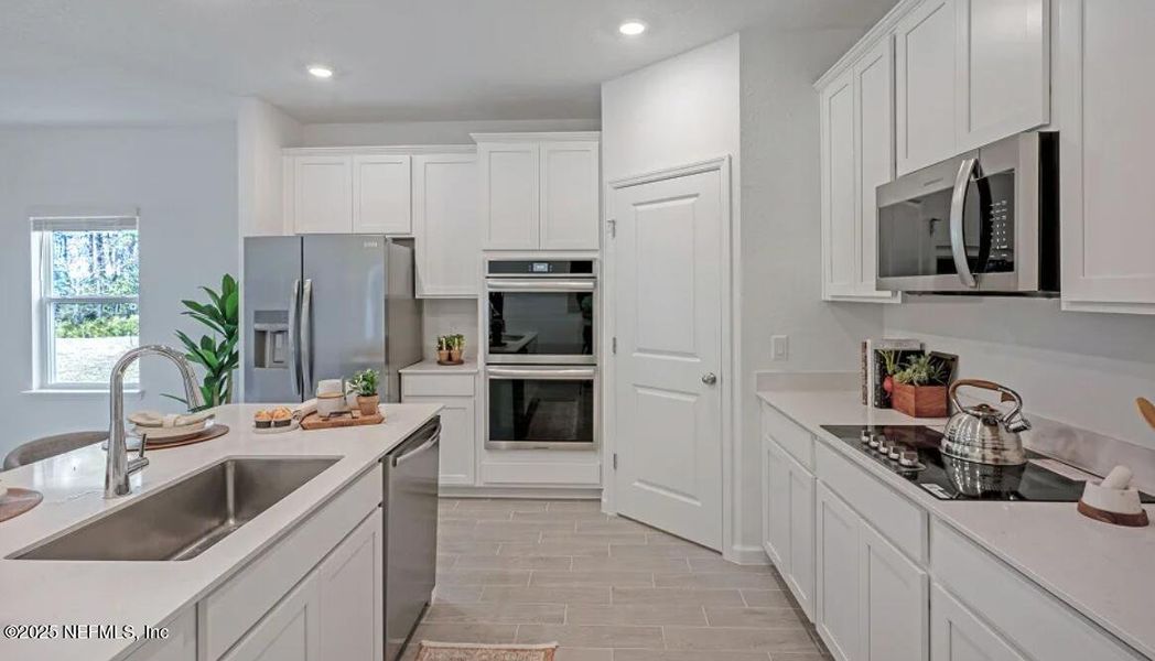 Furnished interior view inside a new home in Edenbrooke at Hyland Trail | 55+: Edenbrooke at Hyland Trail 50s, Green Cove Springs (Image 16).