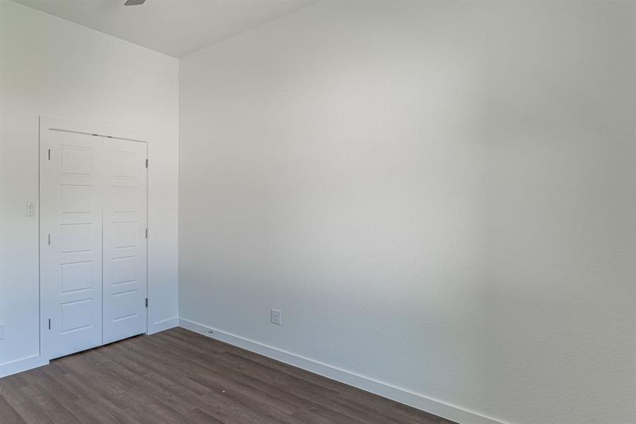 Secondary bedroom with double door closet