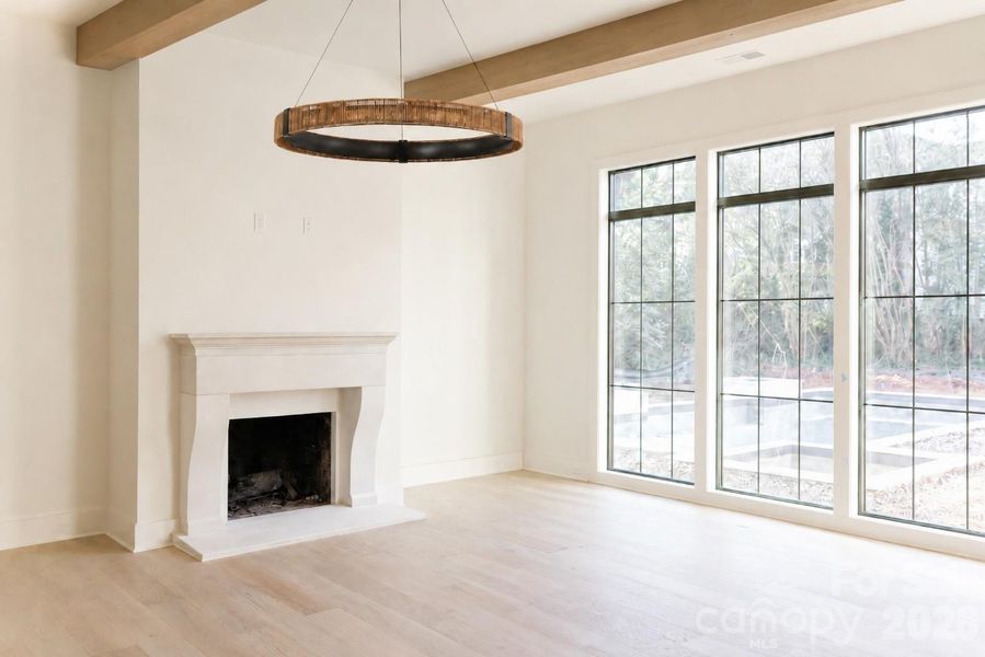 FIREPLACE & BEAM DETAIL-Some images may include digital renderings or AI-enhanced visuals intended to illustrate design intent, finishes, or potential use of space. Actual construction and final finishes may vary