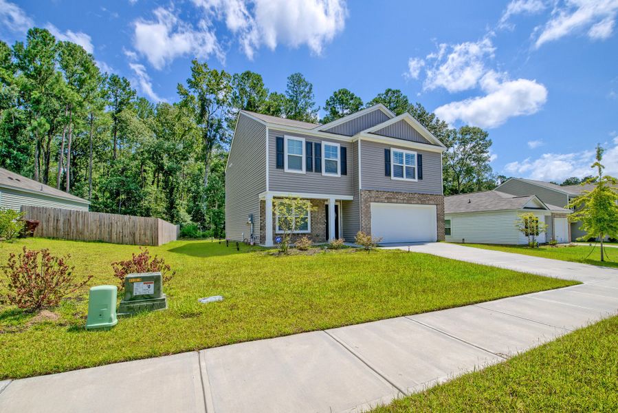 Front exterior of a new home in Stone Ridge, Moncks Corner, SC, highlighting curb appeal (Image 23).