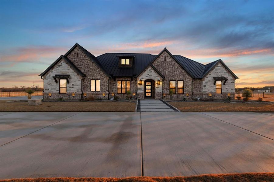 Front exterior of a new home in Santana Ridge, Weatherford, TX, highlighting curb appeal (Image 1). Front exterior of a new home in Santana Ridge, Weatherford, TX, highlighting curb appeal (Image 1).