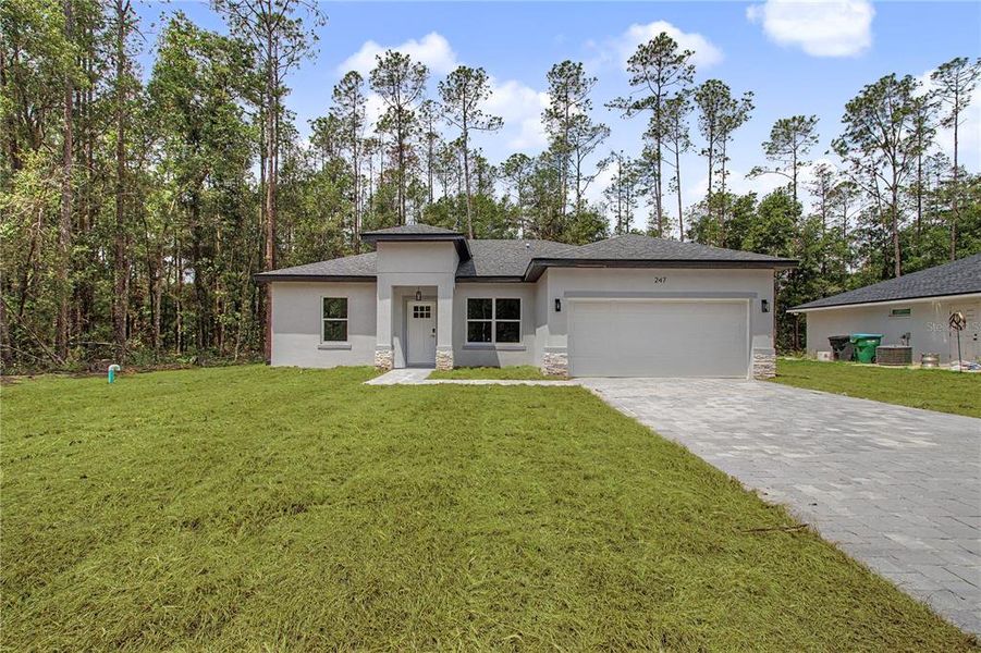 Front exterior of a new home in , Citrus Springs, FL, highlighting curb appeal (Image 22). Front exterior of a new home in , Citrus Springs, FL, highlighting curb appeal (Image 22).