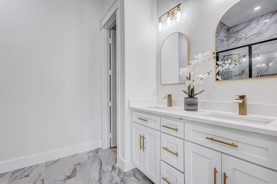 Bathroom featuring vanity and walk in shower