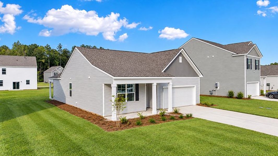 Front exterior of a new home in Pine Hills at Cane Bay, Summerville, SC, highlighting curb appeal (Image 2).