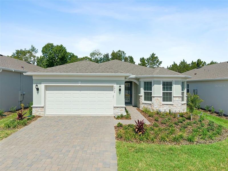 Front exterior of a new home in , Minneola, FL, highlighting curb appeal (Image 23). Front exterior of a new home in , Minneola, FL, highlighting curb appeal (Image 23).