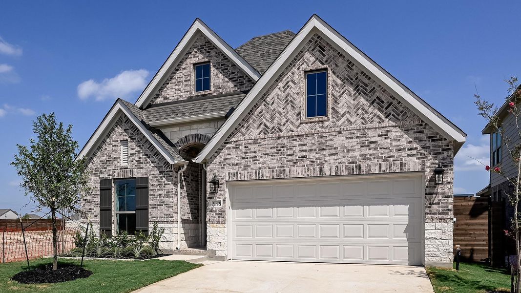 Front exterior of a new home in Juniper Springs, Lockhart, TX, highlighting curb appeal (Image 2).