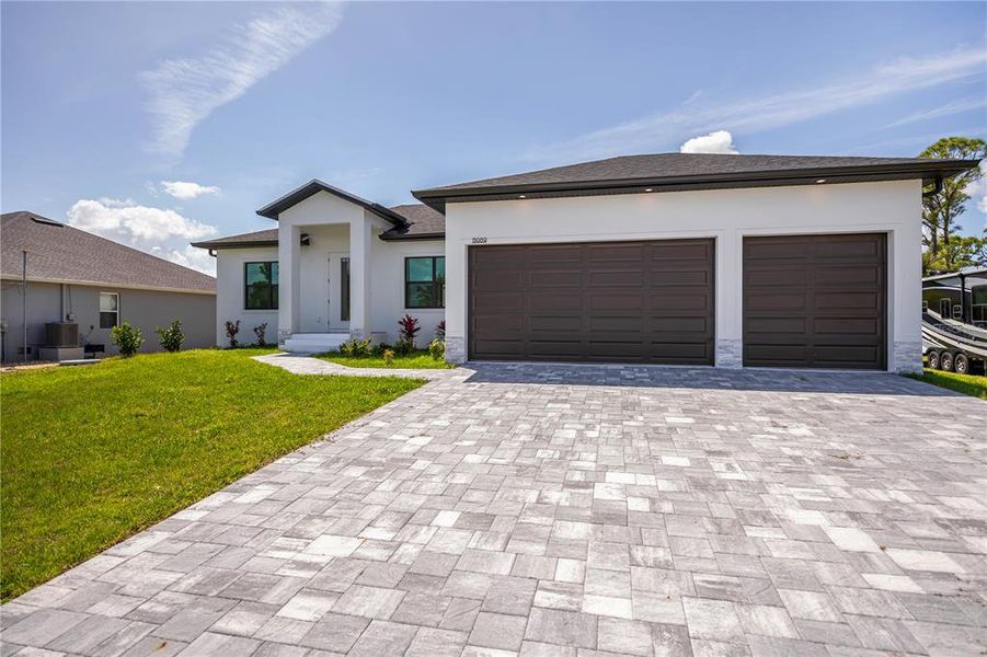 Front exterior of a new home in , Port Charlotte, FL, highlighting curb appeal (Image 28).