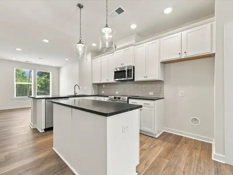 Furnished interior view inside a new home in Central Living at Craig, Charlotte (Image 7).