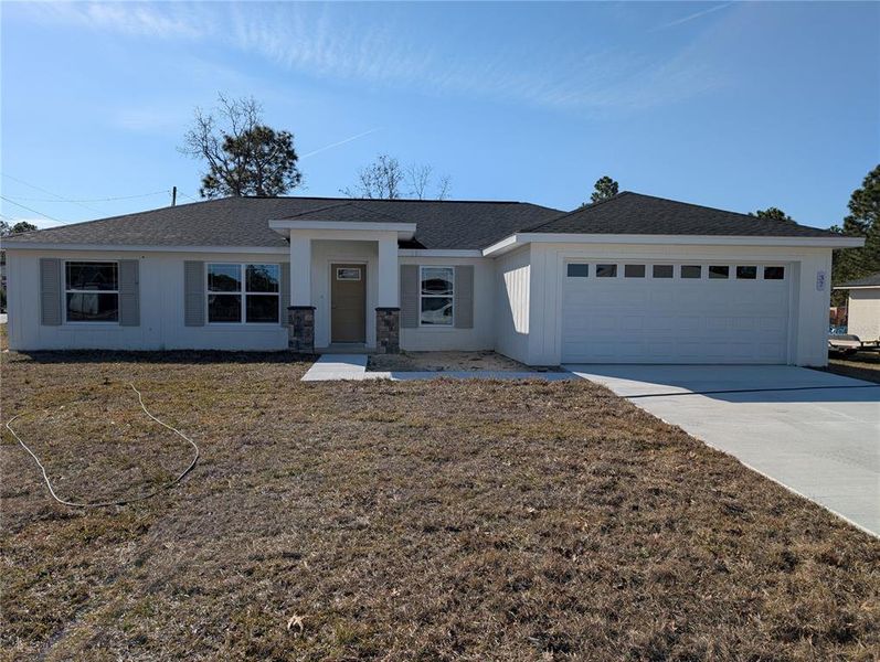 Front exterior of a new home in , Ocala, FL, highlighting curb appeal (Image 1). Front exterior of a new home in , Ocala, FL, highlighting curb appeal (Image 1).