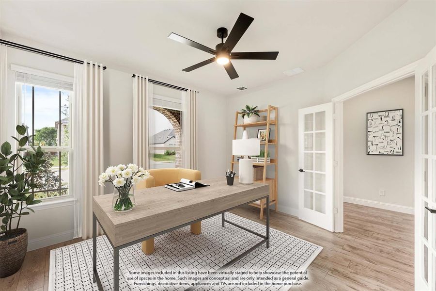 Home office with wood desk, ceiling fan, hardwood floors, and French doors