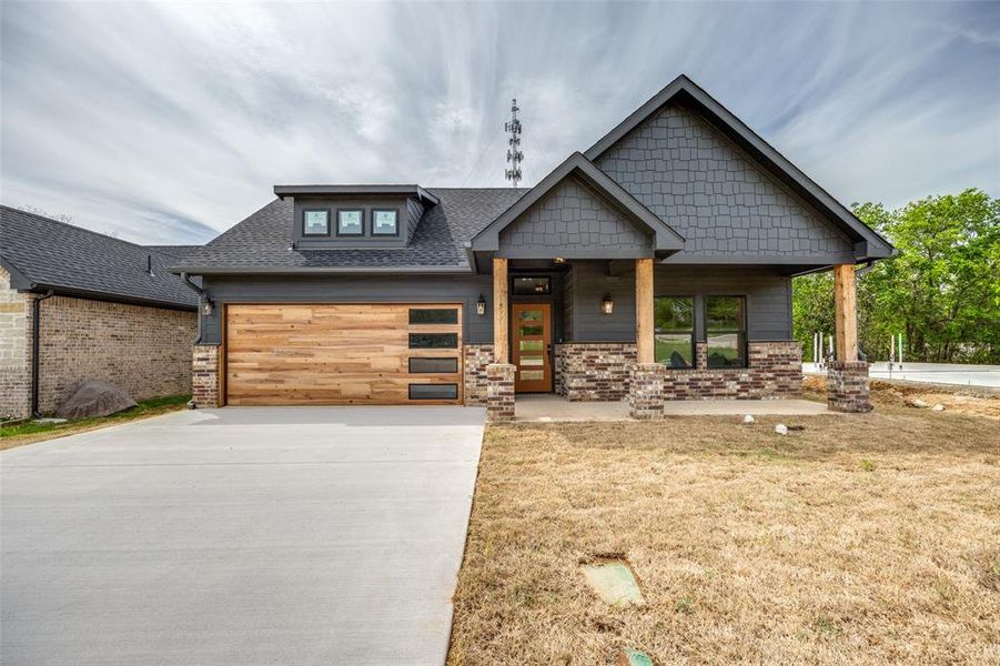 Front exterior of a new home in , Denison, TX, highlighting curb appeal (Image 1). Front exterior of a new home in , Denison, TX, highlighting curb appeal (Image 1).