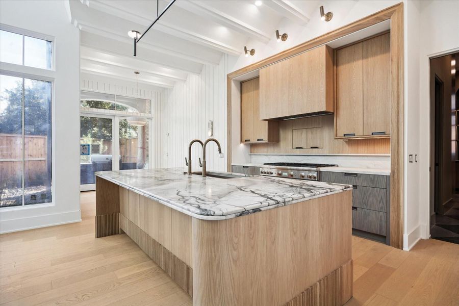 Island kitchen open to breakfast area and den.