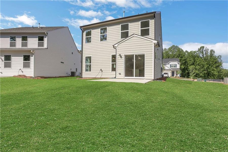 Exterior details and patio area of a home in Villas at Dawsonville, Dawsonville (Image 3).