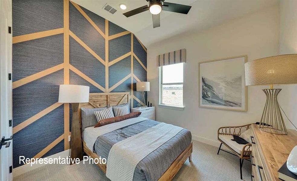 Accent wall featuring a geometric wood panel design over textured blue wallpaper