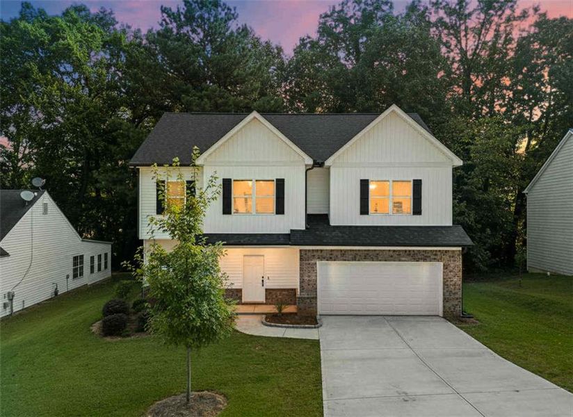 Front exterior of a new home in , Lawrenceville, GA, highlighting curb appeal (Image 2).