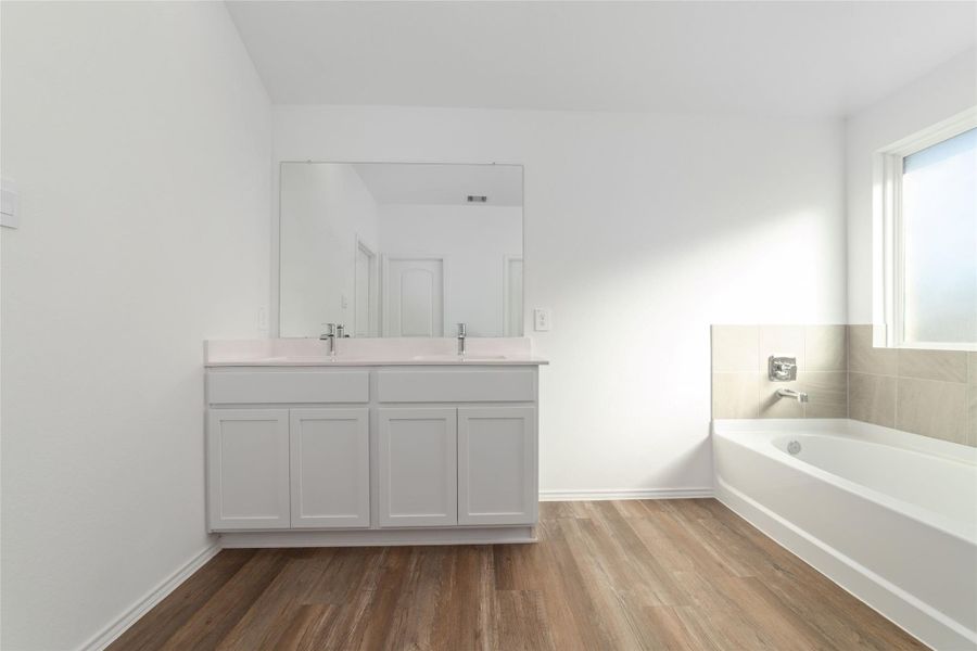 Furnished interior view inside a new home in Sunterra, Katy (Image 12).