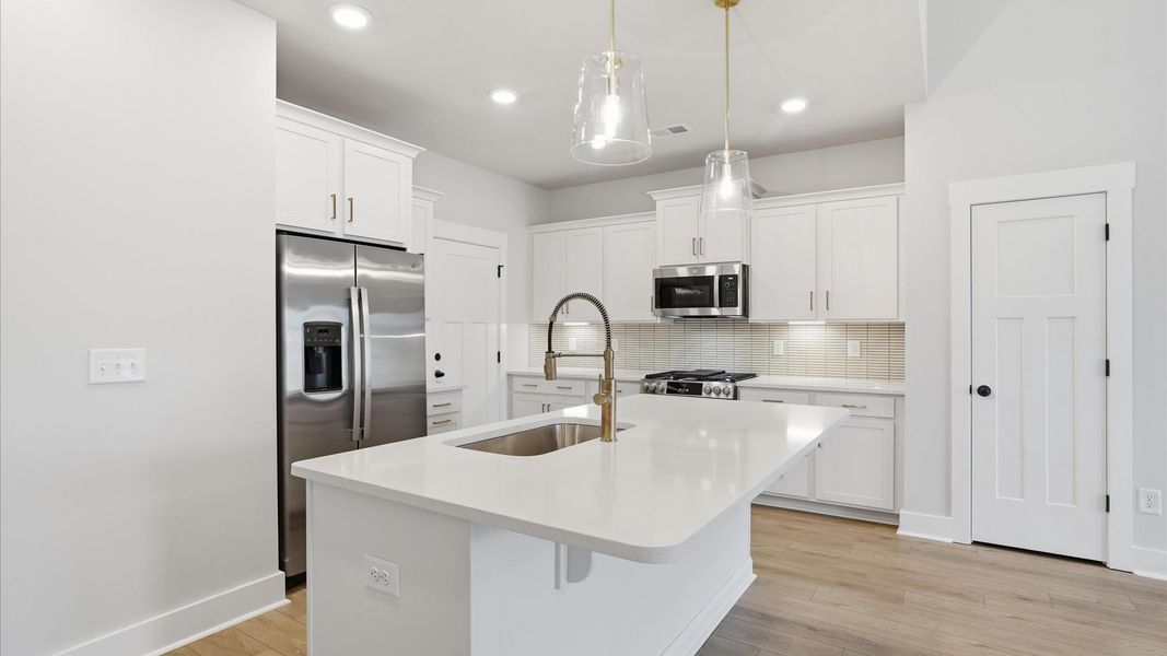 Highly functional kitchen offering a refined look and practical island at the center at Silo Ridge Highly functional kitchen offering a refined look and practical island at the center at Silo Ridge