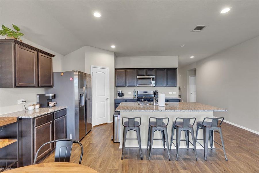 Modern kitchen featuring a spacious island with seating, perfect for casual dining or entertaining.