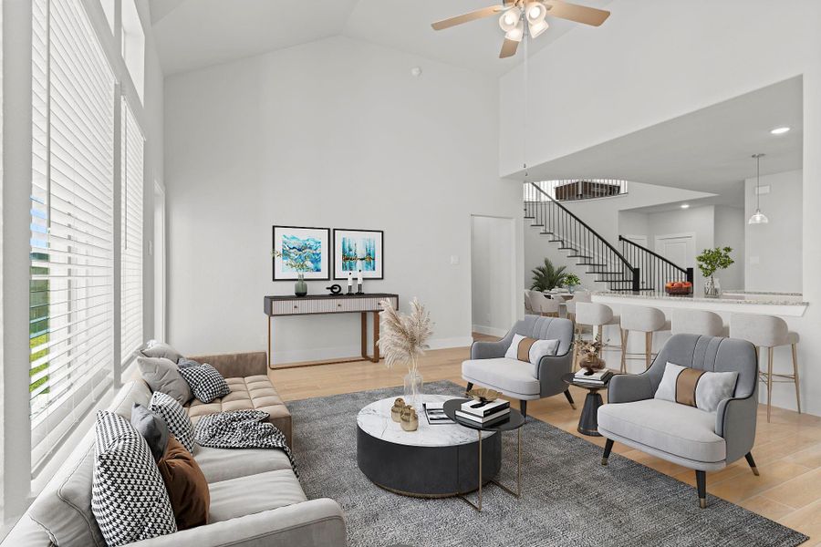 Another angle of the family room reveals how the open layout connects beautifully to the kitchen and grand staircase—creating a natural flow that makes this CastleRock home both stylish and functional. *Photo Staged*