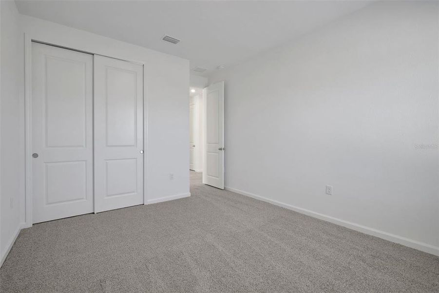 Spacious, unfurnished interior of a new home in Serenade at Ovation, Winter Garden (Image 34).