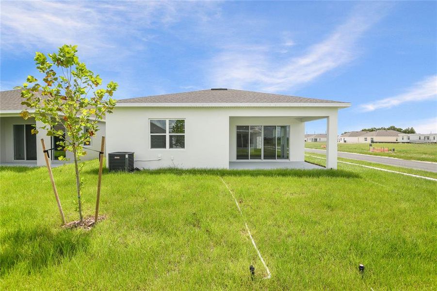 Front exterior of a new home in , Winter Haven, FL, highlighting curb appeal (Image 16).