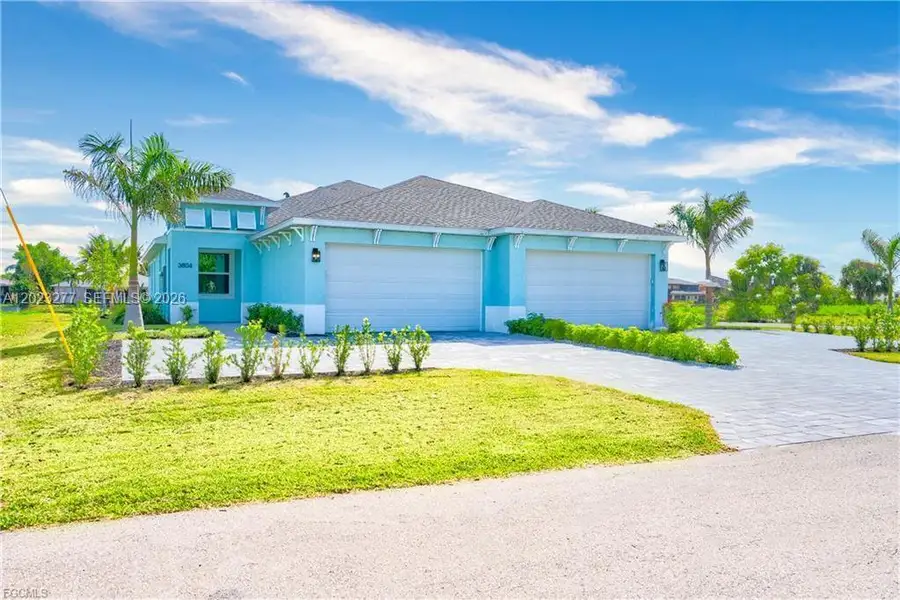 Front exterior of a new home in , Cape Coral, FL, highlighting curb appeal (Image 1). Front exterior of a new home in , Cape Coral, FL, highlighting curb appeal (Image 1).