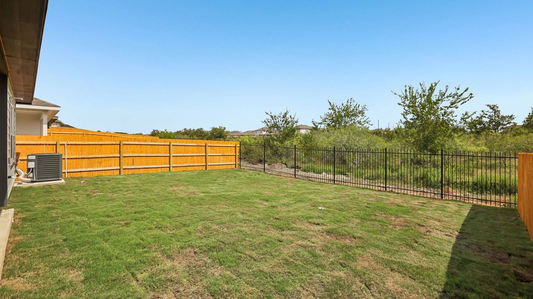 Exterior details and patio area of a home in Prairie Lakes, Buda (Image 20).