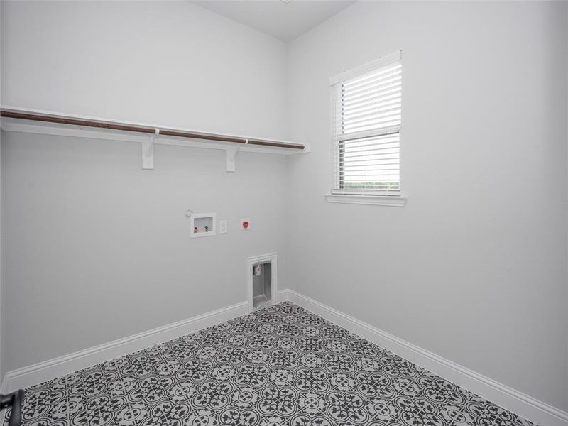 Laundry room featuring washer hookup and electric dryer hookup