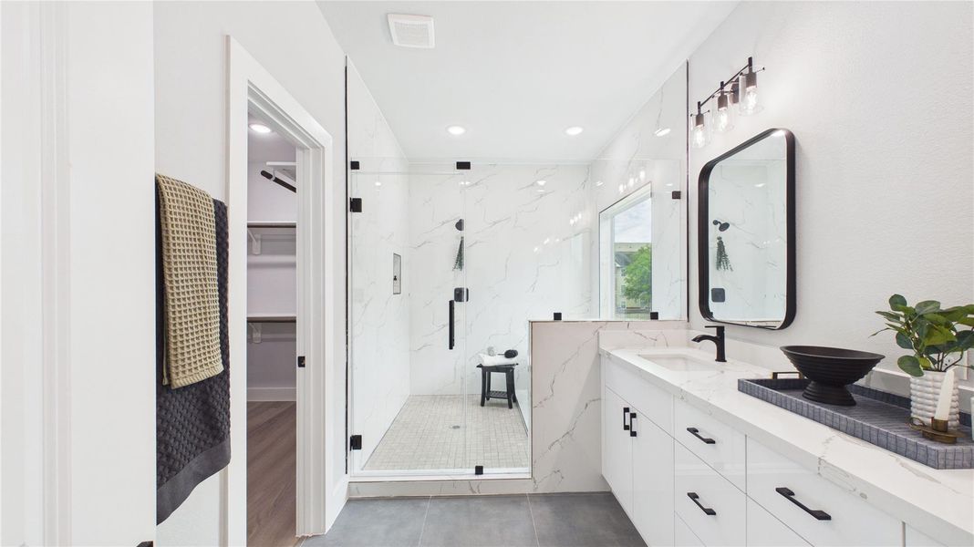 Spa inspired primary bath with lots of closet space