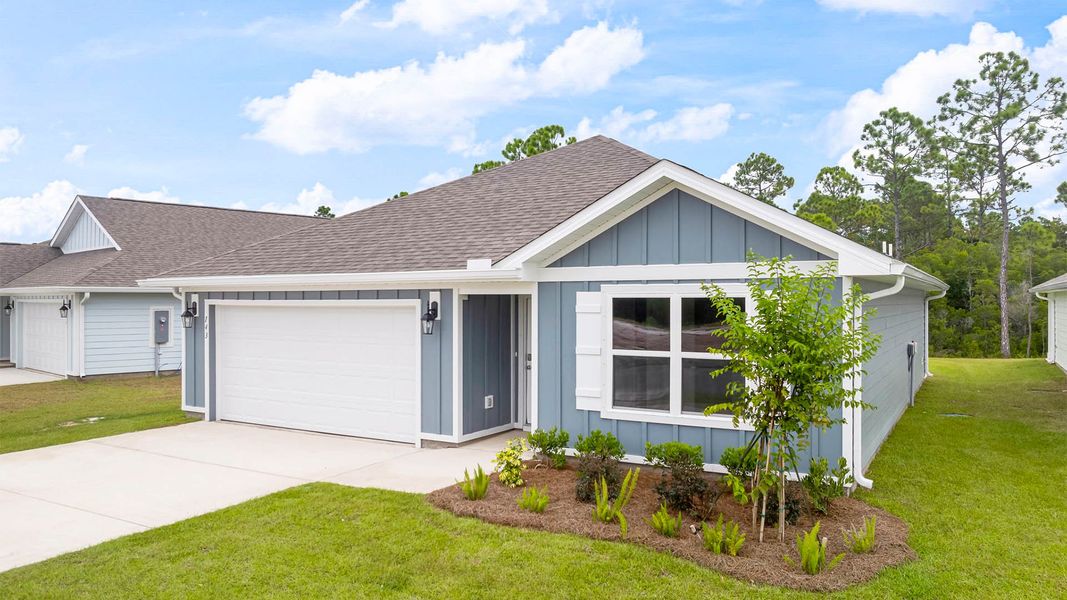 Front exterior of a new home in Palmetto Bluff, Port Saint Joe, FL, highlighting curb appeal (Image 2). Front exterior of a new home in Palmetto Bluff, Port Saint Joe, FL, highlighting curb appeal (Image 2).