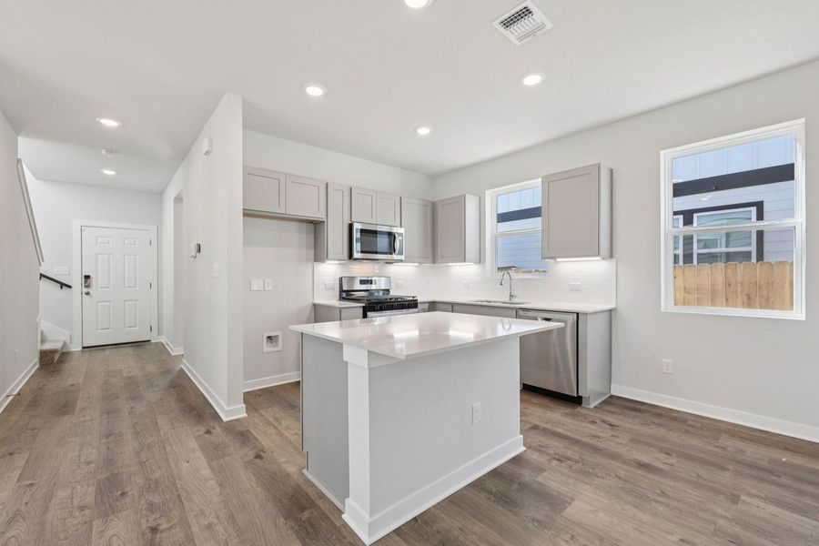 Furnished interior view inside a new home in The Hollows at Avery Centre, Round Rock (Image 6).