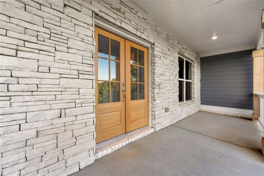 Exterior details and patio area of a home in Steeplechase, Hoschton (Image 24).