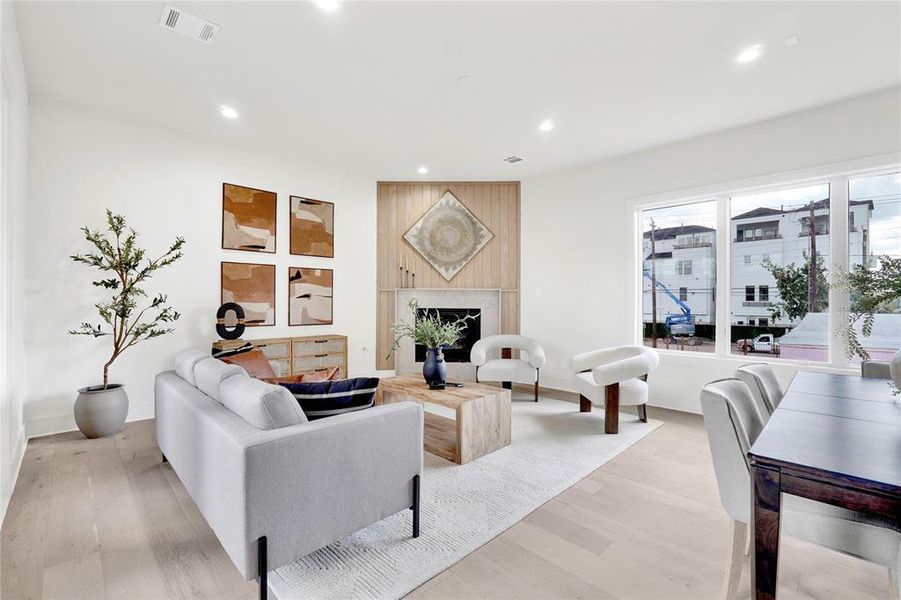 Living area with a high-end gas log fire place.