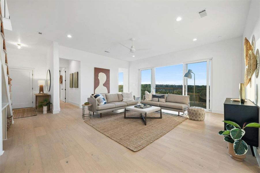 This stunning bonus living area also features 4 panel, dual opening sliders that open the room onto the lower level balcony.