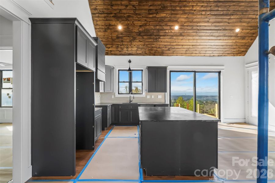 Side view of kitchen and back door to deck Side view of kitchen and back door to deck