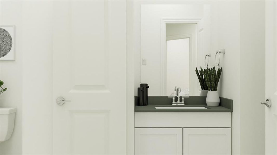 Bathroom featuring vanity and toilet