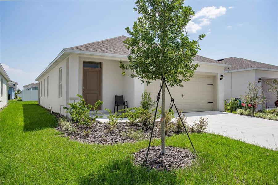 Front exterior of a new home in , Umatilla, FL, highlighting curb appeal (Image 23).
