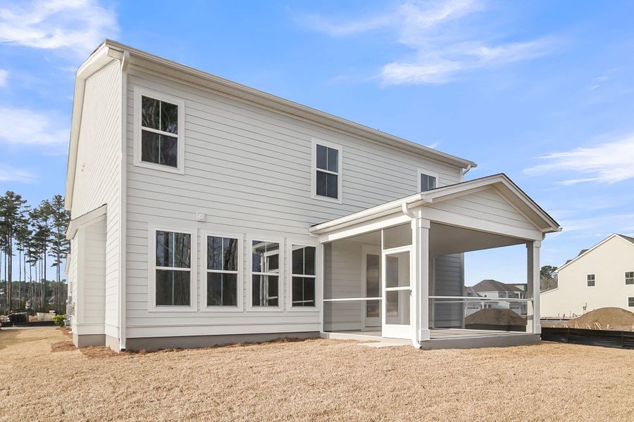 Exterior details and patio area of a home in Tidewater at Lakes of Cane Bay, Summerville (Image 3).