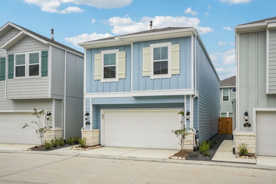 Front exterior of a new home in Kemah Crossing - City Series, Kemah, TX, highlighting curb appeal (Image 27). Front exterior of a new home in Kemah Crossing - City Series, Kemah, TX, highlighting curb appeal (Image 27).