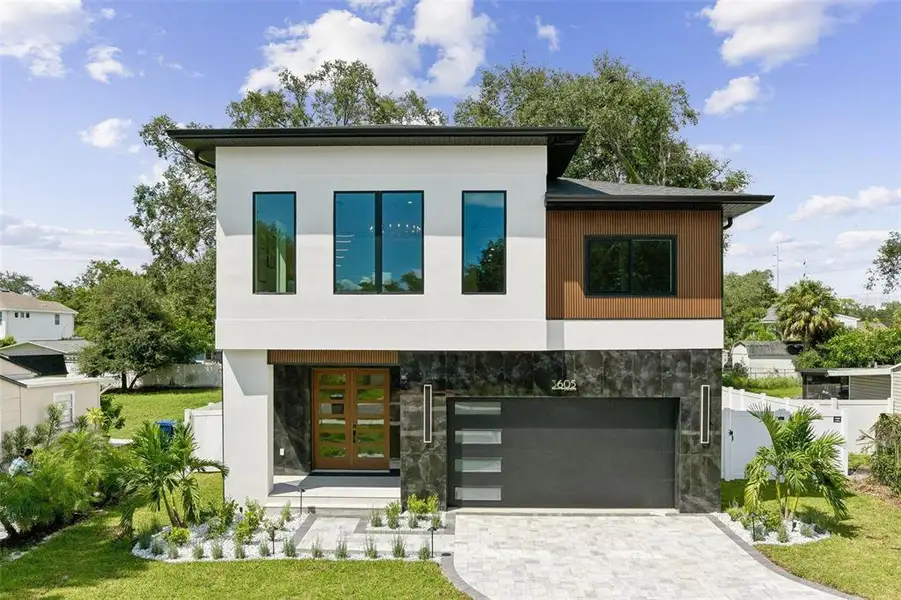 Front exterior of a new home in Wyoming Estates, Tampa, FL, highlighting curb appeal (Image 1). Front exterior of a new home in Wyoming Estates, Tampa, FL, highlighting curb appeal (Image 1).