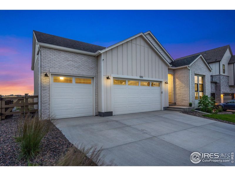 Front exterior of a new home in , Timnath, CO, highlighting curb appeal (Image 2).