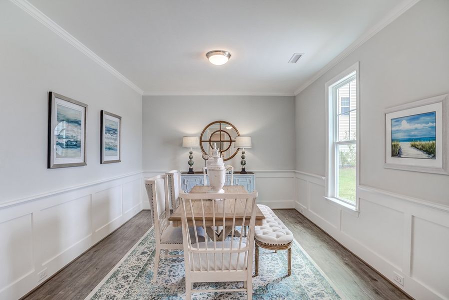 Representative furnished interior of a home built from the The Amherst by RobuckHomes in Windwater, Hampstead (Image 9).