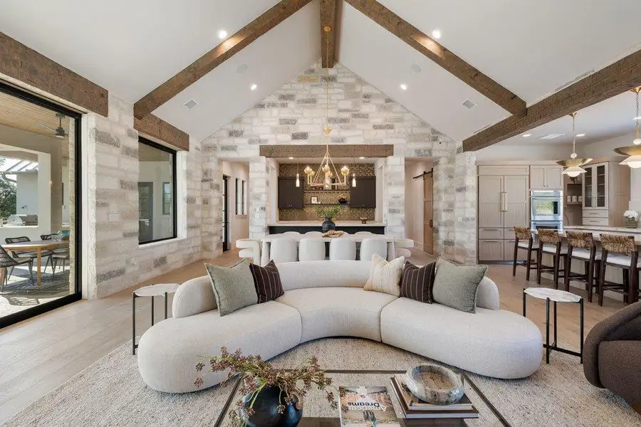 Vaulted ceilings, exposed beams, and floor to ceiling stone create an unforgettable first impression. Vaulted ceilings, exposed beams, and floor to ceiling stone create an unforgettable first impression.