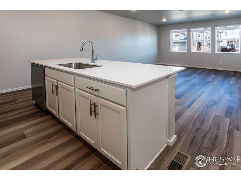 KITCHEN OPEN TO LIVING AND DINING ROOM