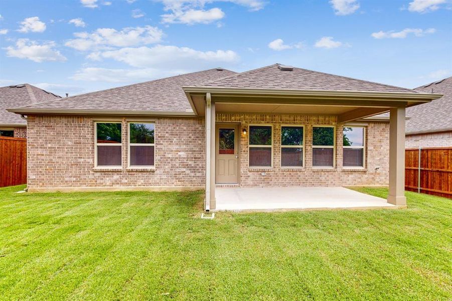 Front exterior of a new home in Kings Way, Denton, TX, highlighting curb appeal (Image 13). Front exterior of a new home in Kings Way, Denton, TX, highlighting curb appeal (Image 13).