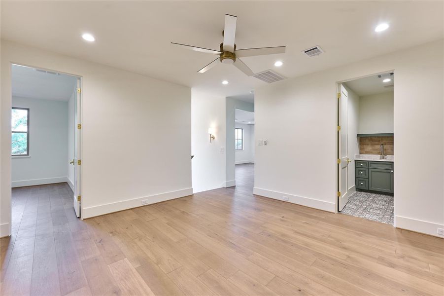 Versatile upstairs landing offers the perfect space to entertain, work, or unwind with play!
